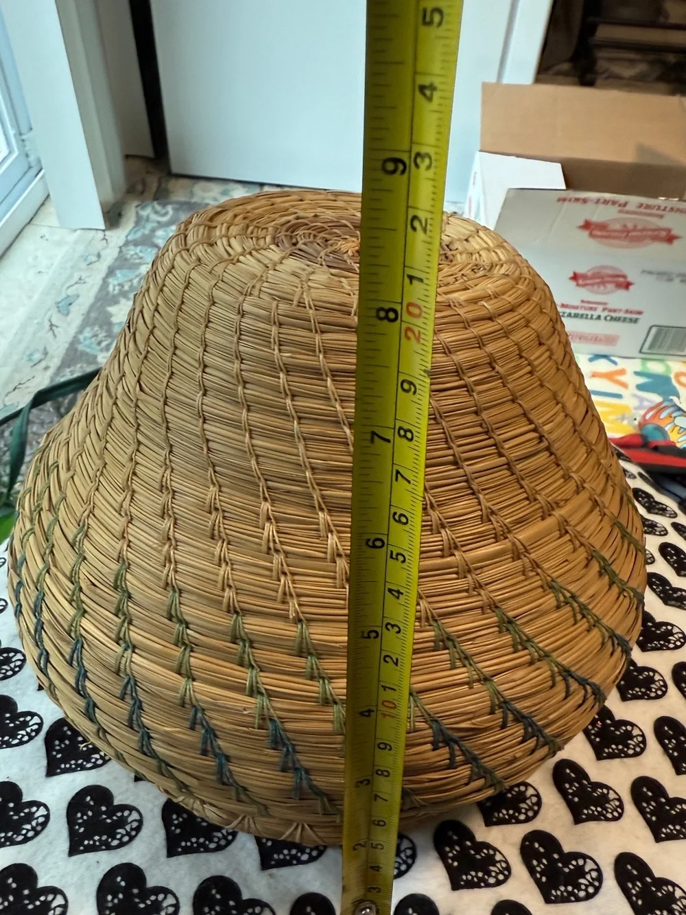 vintage Native American style pine needle basket, similar to those identified
